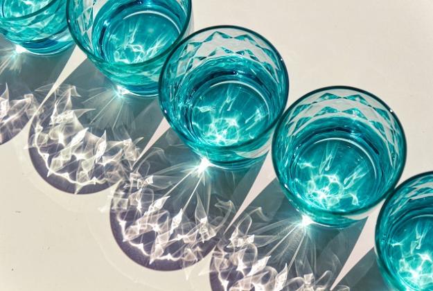 A photo of glasses full of water