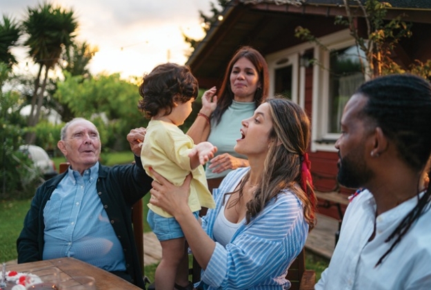 A family around a table outside