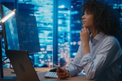 Women studying computer screen with curiosity 