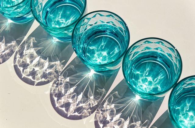 A photo of glasses full of water