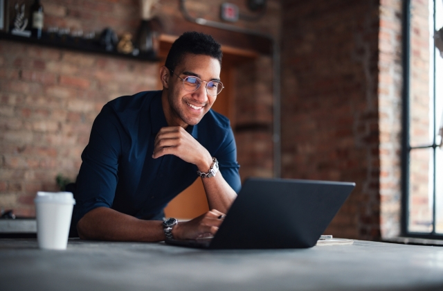 Professional looking at laptop